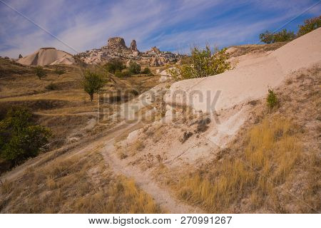 Uchisar, Cappadocia, Turkey: The Road On The Field Goes To The City And The Fortress Of Uchisar. Roc