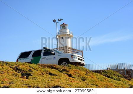 SAN YSIDRO, CALIFORNIA - NOVEMBER 26, 2018: A Border Patrol Vehicle watches over the beach and border at Imperial Beach, San Ysidro.