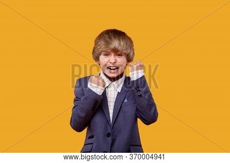 The Little Boy Is Very Angry. Fists Near His Face.
