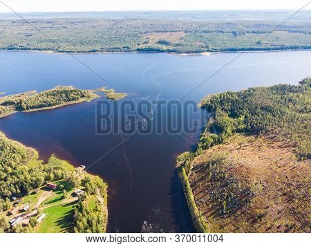 View Of Kalix River, Kalixalven, Overkalix Locality And The Seat In Norrbotten County, Sweden, With