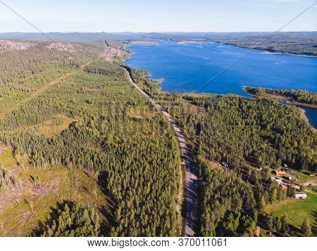 View Of Kalix River, Kalixalven, Overkalix Locality And The Seat In Norrbotten County, Sweden, With