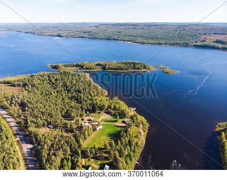 View Of Kalix River, Kalixalven, Overkalix Locality And The Seat In Norrbotten County, Sweden, With