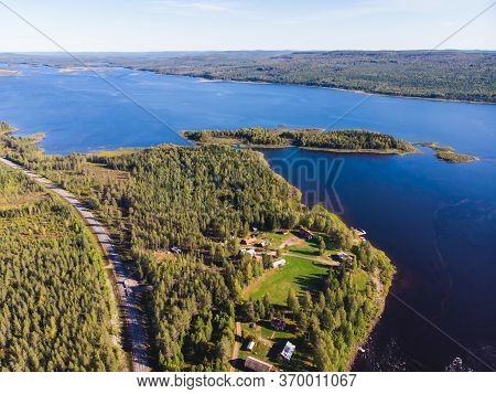 View Of Kalix River, Kalixalven, Overkalix Locality And The Seat In Norrbotten County, Sweden, With