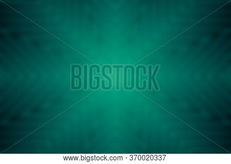 Dark Green Blurry Abstract Background With Light Rays From Center Ideal For Using As Texture Too.