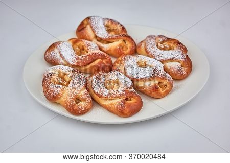 Sweet Patties With Apples On A White Background