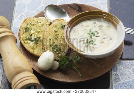 Garlic Bread And Cream Mushroom Soup On The Woodplate