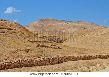 Judean Desert In Israel, Palestine. Rocks And Blue Sky On A Sunny Day. Near The Monastery Of Sava Sa