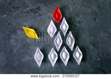 The Formation Of Individuality In Society Concept With Yellow Paper Boat Breaks Out From The Order O