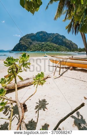 Traditional Banca Boat On Sandy Corong Corong Beach In El Nido, Philippines