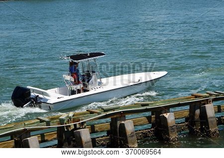 Father Accompanied By His Toddler Son Cruising On Biscayne Bay In A Small Open Sport Fishing Boat.