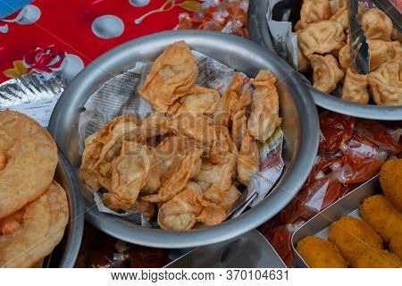 Kolkata, West Bengal, India - 16th December, 2018 : Deep Fried Pork Momo, Fresh Chinese Food Being S