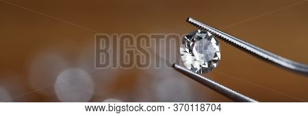 Painstaking Jewelry Work, Looking At Diamond. Master Holds Small Gem With Tweezers. In Foreground, T