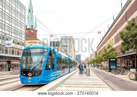Stockholm, Sweden - August 8, 2019: Wiev On A Blue New Style Tram On Stop With People At T-centrale 