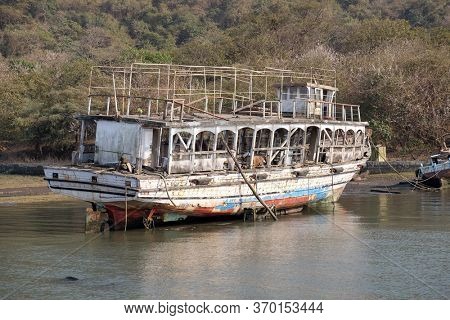 MUMBAI, INDIA - FEBRUARY 15, 2020: Abandoned tourist boat on Elefanta Island near Mumbai, India