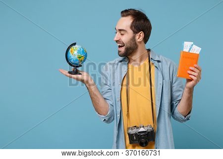 Funny Traveler Tourist Man In Summer Clothes With Photo Camera Isolated On Blue Background. Male Pas