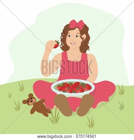 Beautiful Little Girl With Strawberries. A Child Sitting In A Meadow With Strawberries And A Teddy B