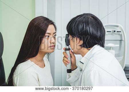 Consultation With An Ophthalmologist. Young Asian Woman And Doctor