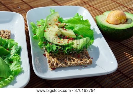 Risp Sandwich With Avocado. Snack Bread And Fiber Food. Wheat Crisp Bread. Flat Lay