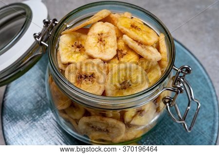 Healthy Snack, Crispy Dehydrated Unsugared Banana Chips In Glass Jar