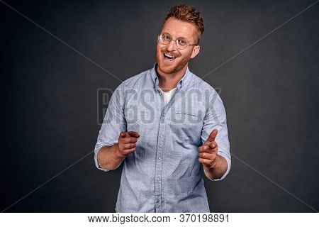 Portrait Of Charming Cheerful And Carefree Young Caucasian Man With Redbeard In Sunglasses And Trend