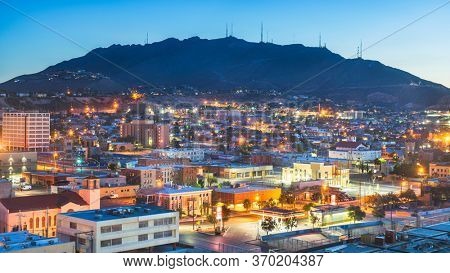 El Paso, Texas, USA  downtown city skyline at dusk with Juarez, Mexico in the distance.