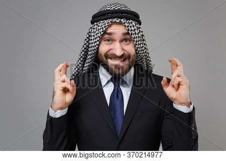 Arabian Muslim Businessman In Keffiyeh Kafiya Ring Igal Agal Isolated On Gray Background. Achievemen
