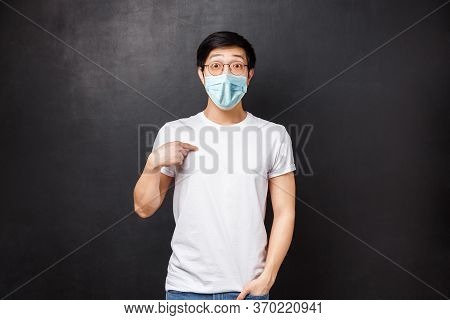 Portrait Of Surprised Confused Handsome Asian Guy Being Chosen Or Named, Pointing Himself With Disbe