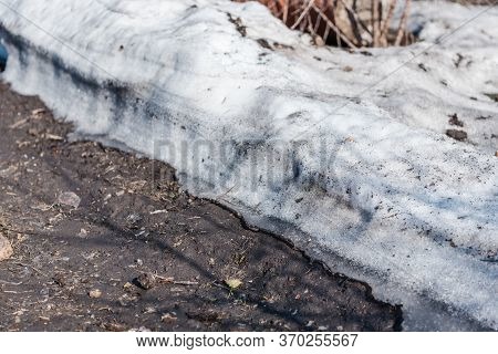 Spring Is On The Street. Dirty Snow. Snow Melts. Spring Weather.