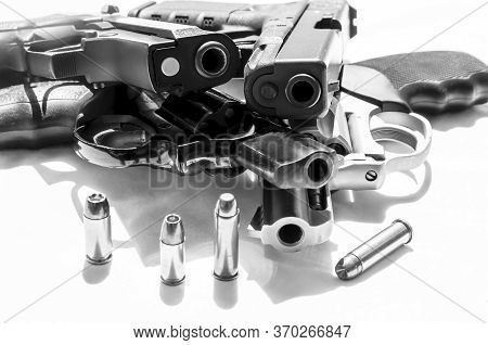 Four Handguns, Two Revolvers, A 38 Caliber And A 357 Magnum And Two Pistols, A 9mm And A Forty Calib