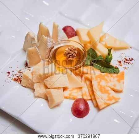 Camembert Cheese, Figs, Jamon, Honey And Grapes.