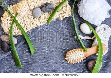 Spa And Bath Cosmetics With Aloe Vera. Natural Materials In Bathroom. Wooden Hair Brush. Bamboo Comb