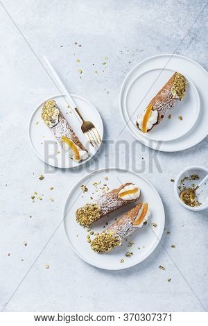 Traditional Italian Dessert Cannoli Siciliani On The Light Background, Top View Image With A Copy Sp