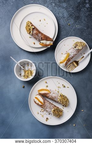 Traditional Italian Dessert Cannoli Siciliani On The Dark Background, Top View Image With A Copy Spa
