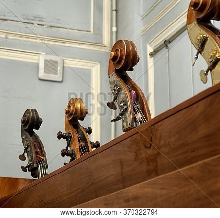 Contrabass On Stage In Front Of An Empty Hall