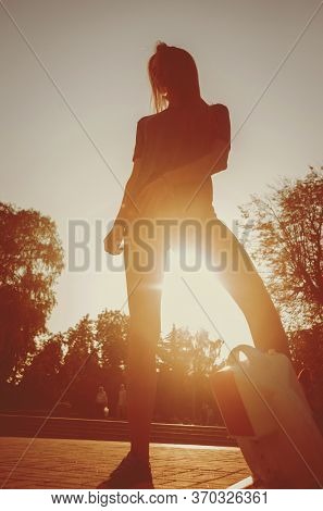 Young Couple Driving On Monowheel In The Park