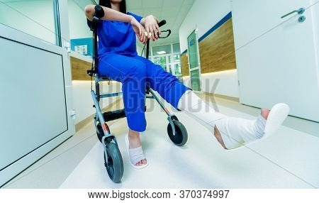 Patient On Rollator With Hand Brakes Moving In Hospital