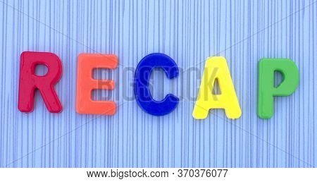 Recap Word Made Up Of Plastic Letters On A Blue Background. Business Concept.