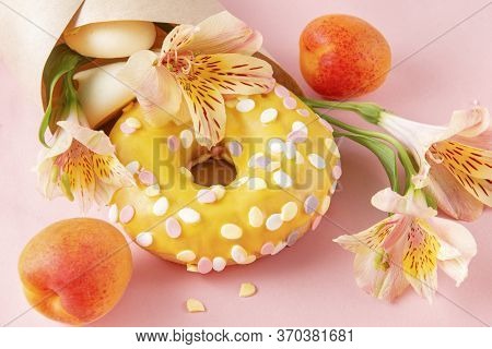 1 Donut With Yellow Icing, French Cookies, Fresh Apricots, Alstroemeria Flowers In An Envelope On A 