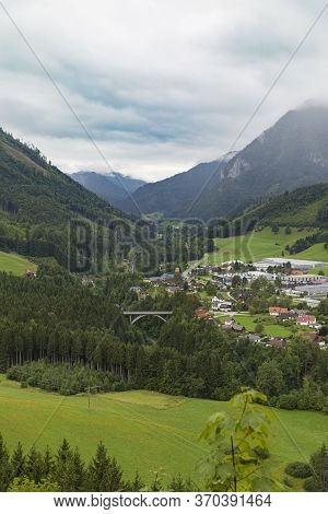 View Of The Mountain Village Of St. Gallen In Alpine Mountains Covered In Fog From Gallenstein Castl
