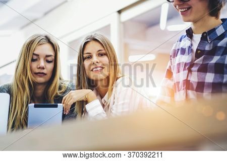 Young It Programmers Collaborating On Creating Application Using Digital Computers