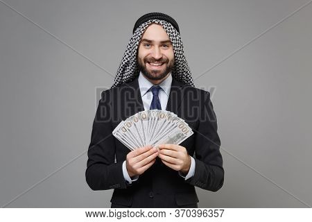 Smiling Bearded Arabian Muslim Businessman In Keffiyeh Kafiya Ring Igal Agal Suit Isolated On Gray B