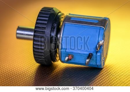 Close up shot of stepper motor on gold background