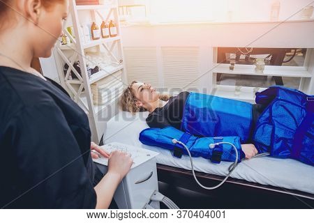 Pressotherapy Machine On Woman In Beauty Center