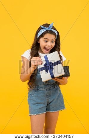 Surprised Kid On Yellow Background. Birthday Surprise For Her. Bargain Sale Concept. Black Friday Di