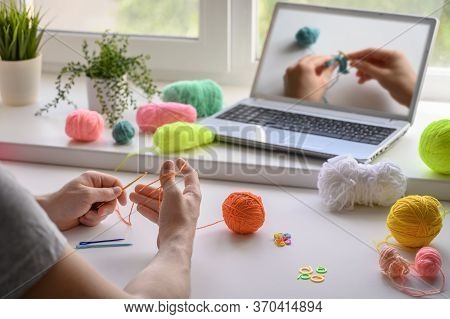 Selective Focus On The Hands Of A Man Sitting At The Table And Watching A Video Step By Step Guide O