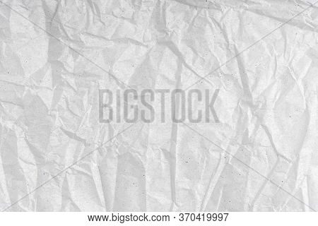 White Wrinkled Creased Paper Texture. Blank Crumpled Grainy Paper Textured Surface. Smudged Grungy G