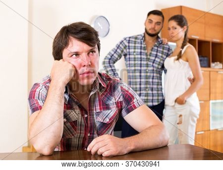 Conflict In Young Polygamous Couple Indoors In The Living Room