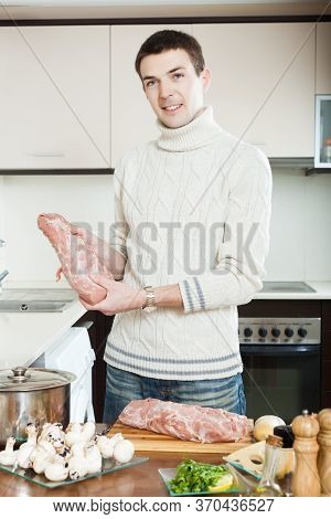 Man Cooking Veal Prince Orloff At Kitchen