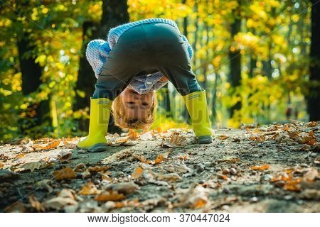 Hide And Seek. Child Having Fun In Forest. Forest School Is Outdoor Education. Visit Natural Spaces.