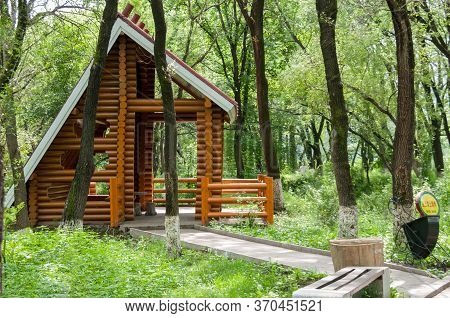 China, Heihe, July 2019: A Wooden Holiday House In A Park On The Waterfront In Heihe City In The Sum